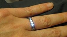 A man has designedan engagement ring that lights up when the couple holds hands.